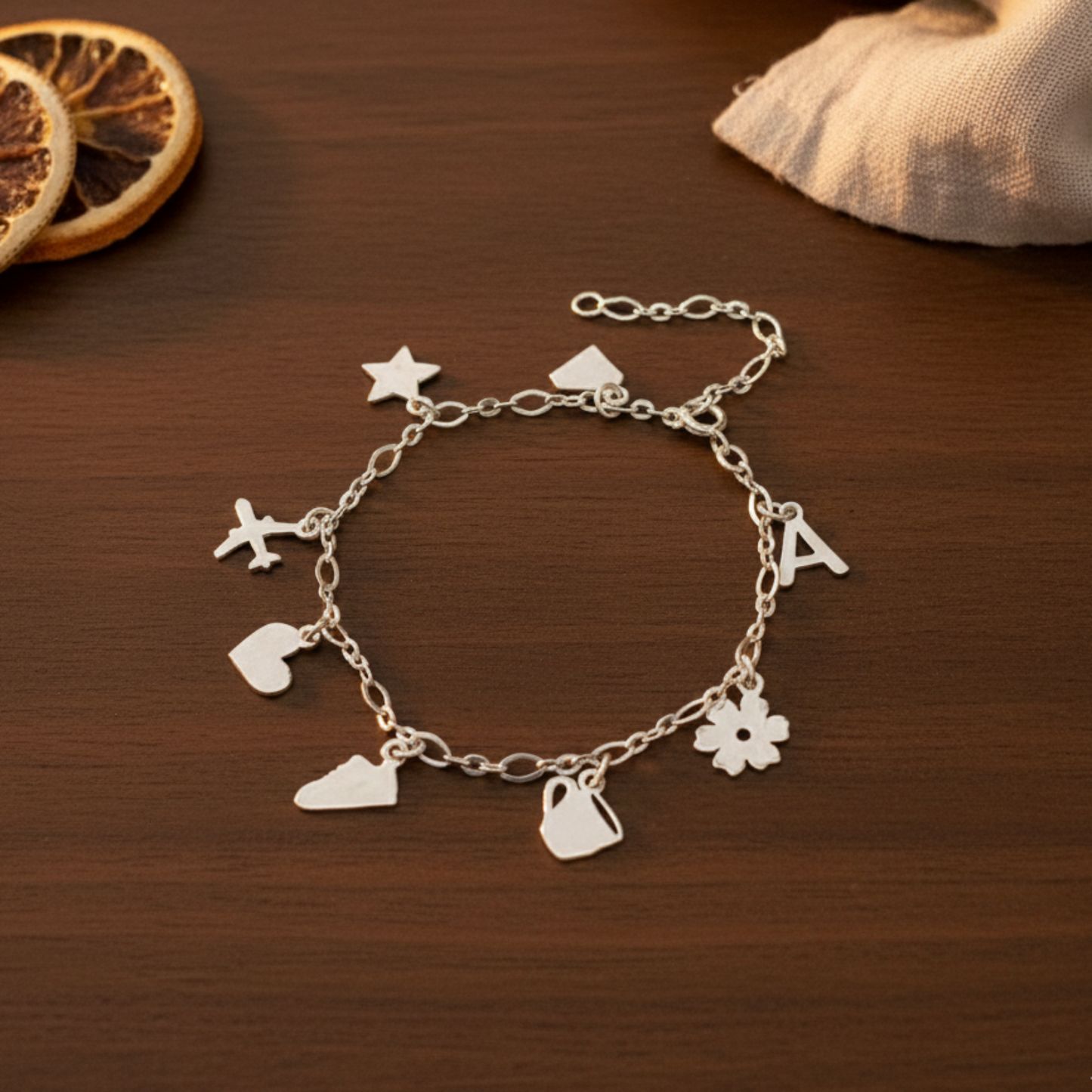Gold and silver charms bracelet in 92.5 sterling silver